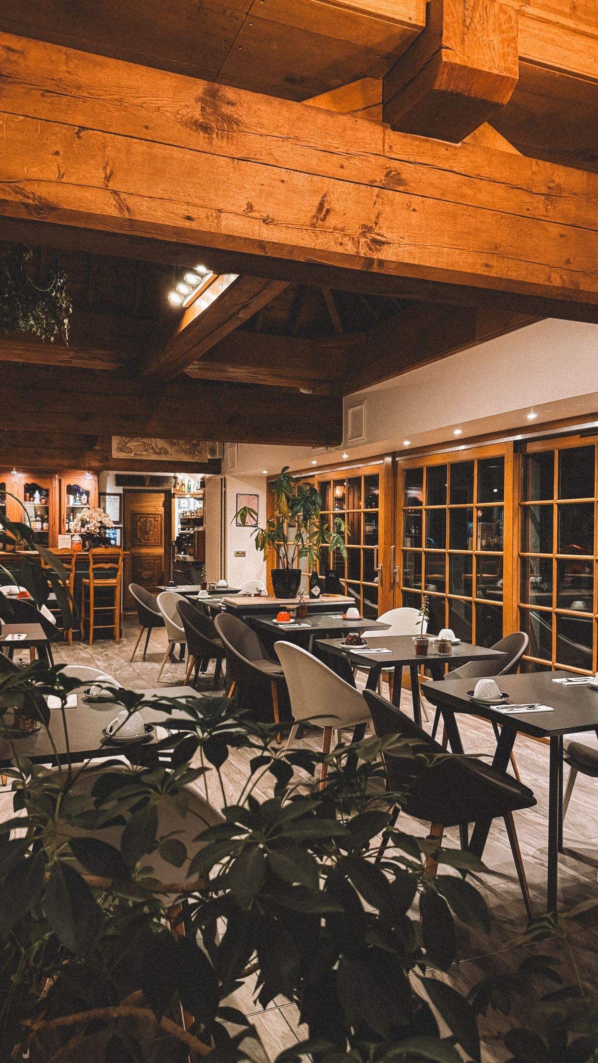 Rustic dining room with wooden beams and warm lighting